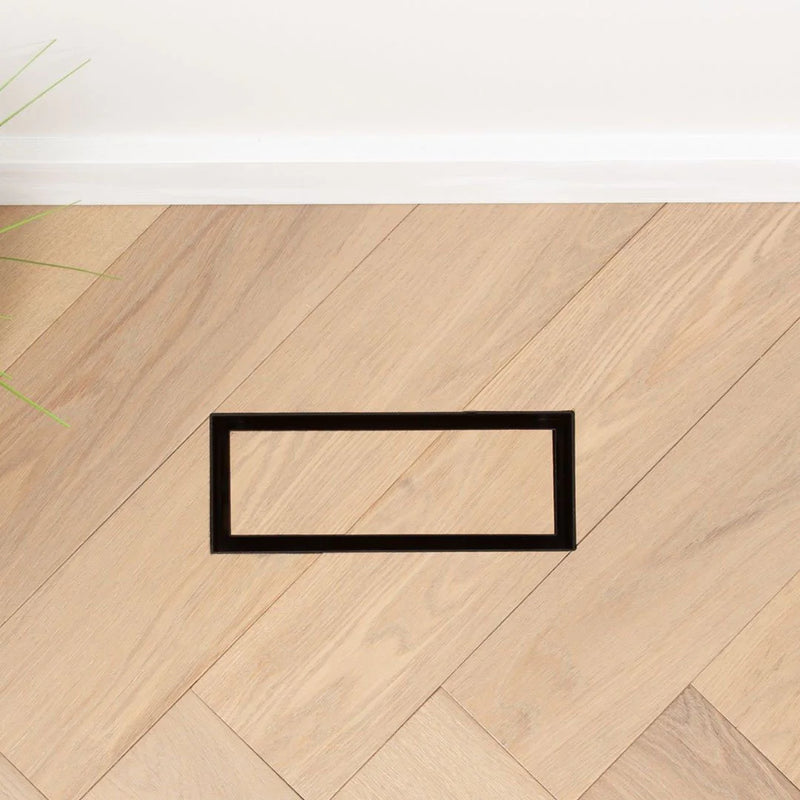 Fittes Under Mount vent installed level with hardwood flooring