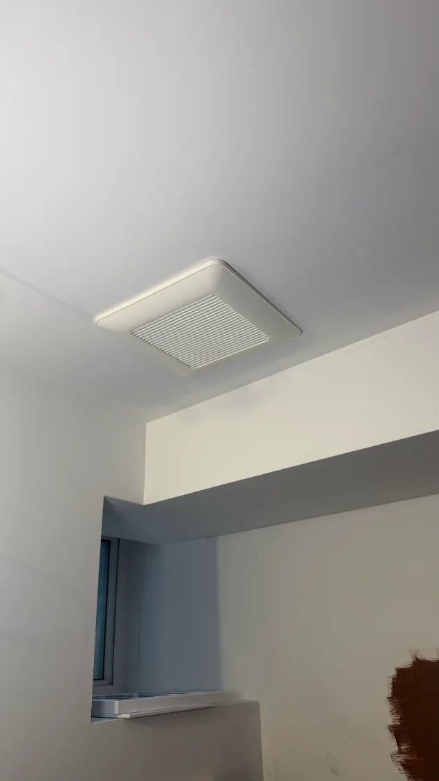 Before: exposed bathroom exhaust fan grille