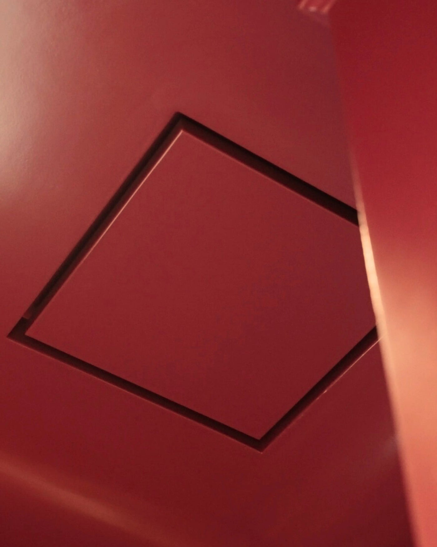 Low-profile bathroom exhaust fan cover painted to match the ceiling